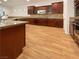 Beautiful kitchen with stainless steel appliances, tile backsplash, granite countertops, and wood flooring at 7719 Windy Meadow Ave, Las Vegas, NV 89178