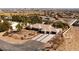 Aerial view of a desert home with a circular driveway and desert landscaping at 8290 Gagnier Blvd, Las Vegas, NV 89113