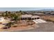 Desert home featuring a three-car garage, low maintenance landscaping, and mountain views at 8290 Gagnier Blvd, Las Vegas, NV 89113