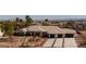 Expansive desert home with three-car garage, landscaped yard, and views of the city at 8290 Gagnier Blvd, Las Vegas, NV 89113
