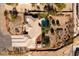 Aerial image of a desert home and property featuring mature landscaping, a pool, and patio at 8290 Gagnier Blvd, Las Vegas, NV 89113