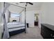 Comfortable bedroom with four poster bed and ensuite bathroom access at 8290 Gagnier Blvd, Las Vegas, NV 89113