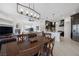 Dining room with a view of the kitchen and living area creating an open, inviting space at 8290 Gagnier Blvd, Las Vegas, NV 89113