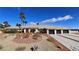 Beautiful single-story home with manicured desert landscaping and a three-car garage at 8290 Gagnier Blvd, Las Vegas, NV 89113
