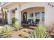 Inviting front porch with seating area, desert plants, and stylish decor at 8290 Gagnier Blvd, Las Vegas, NV 89113