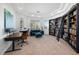 Bright and airy office with large windows, custom shelving, and comfortable seating at 8290 Gagnier Blvd, Las Vegas, NV 89113