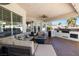 Inviting back patio with an outdoor kitchen and comfortable seating area, great for outdoor entertaining at 8290 Gagnier Blvd, Las Vegas, NV 89113