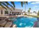 Gorgeous pool and spa with rock waterfall feature and a spacious patio area, ideal for outdoor living at 8290 Gagnier Blvd, Las Vegas, NV 89113