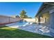 Beautiful backyard pool with a covered patio and plenty of space for entertaining at 9 White Tail Ct, Henderson, NV 89074