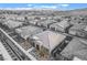 An aerial view showcases a community of modern homes with desert landscaping and mountain views at 905 Belleforte Ln, Las Vegas, NV 89138