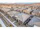 An aerial view showcases a community of modern homes with desert landscaping and mountain views at 905 Belleforte Ln, Las Vegas, NV 89138