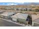 Aerial view of a single-Gathering home featuring desert landscaping, stone accents, and a two-car garage at 905 Belleforte Ln, Las Vegas, NV 89138