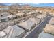 Aerial view of modern homes in a desert community with meticulous landscaping and mountain views at 905 Belleforte Ln, Las Vegas, NV 89138