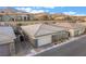 Beautiful single-Gathering home featuring a two-car garage, stone accents, and desert landscaping at 905 Belleforte Ln, Las Vegas, NV 89138