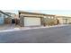 Exterior shot showcasing a modern home with a two car garage and stone accents at 905 Belleforte Ln, Las Vegas, NV 89138