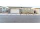 Exterior showcasing a modern home with a two car garage, small bushes and stone accents at 905 Belleforte Ln, Las Vegas, NV 89138