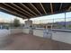 Outdoor grill station with stainless steel grills and a covered pergola providing shade for cooking at 905 Belleforte Ln, Las Vegas, NV 89138