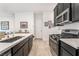 Well-equipped kitchen with stainless appliances, gas range, and an open layout at 905 Belleforte Ln, Las Vegas, NV 89138