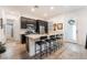 Stylish kitchen with dark cabinets, a large center island, and modern appliances at 905 Belleforte Ln, Las Vegas, NV 89138