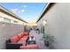 Charming outdoor patio with brick pavers, ample seating, and lovely string lights at 905 Belleforte Ln, Las Vegas, NV 89138