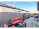 Cozy outdoor patio with brick pavers, string lights, and comfortable seating at 905 Belleforte Ln, Las Vegas, NV 89138