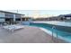 Stunning community pool area with mountain views, tanning ledges, and ample lounging space at 905 Belleforte Ln, Las Vegas, NV 89138