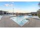 Community pool featuring lap lanes, comfortable lounge seating and a picturesque mountain backdrop at 905 Belleforte Ln, Las Vegas, NV 89138