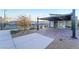 Community recreational area with tennis courts, seating, tables and covered barbecue at 905 Belleforte Ln, Las Vegas, NV 89138