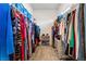 Walk-in closet with shelving, hanging racks and carpet floor at 905 Belleforte Ln, Las Vegas, NV 89138