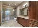 Luxurious bathroom showcasing a glass-enclosed shower, vanity, and stylish fixtures at 9103 Alta Dr # 102, Las Vegas, NV 89145