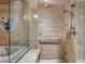 Accessible bathroom featuring a tub with seat, handheld shower and tiled walls at 9103 Alta Dr # 102, Las Vegas, NV 89145