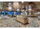 Elegant community room with comfortable seating, large windows with city views, and decorative lighting fixtures at 9103 Alta Dr # 102, Las Vegas, NV 89145