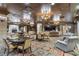 Luxurious community room featuring elegant seating areas, chandeliers, and a fireplace, perfect for gatherings at 9103 Alta Dr # 102, Las Vegas, NV 89145