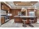 Gourmet kitchen with stainless steel appliances, granite countertops, and breakfast bar at 9103 Alta Dr # 102, Las Vegas, NV 89145