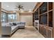 Inviting living room with a large sectional couch, multiple screens, and a fireplace at 9103 Alta Dr # 102, Las Vegas, NV 89145