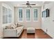 Inviting living room with a comfortable sofa, plush ottoman, and ample natural light at 9103 Alta Dr # 102, Las Vegas, NV 89145