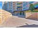 Expansive outdoor patio area with beautiful stonework and community views at 9103 Alta Dr # 102, Las Vegas, NV 89145