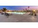 Swimming pool featuring wrought iron chairs and bordering, set against a scenic background at 9103 Alta Dr # 102, Las Vegas, NV 89145