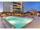 Luxurious swimming pool with lounge seating, lush landscaping, and stunning architecture, ideal for relaxing at 9103 Alta Dr # 102, Las Vegas, NV 89145