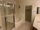 Bright bathroom with a soaking tub, glass shower, and double sinks at , Las Vegas, NV 89148