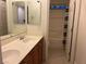 Bathroom features dual sinks, wooden vanity, and shower with curtain at , Las Vegas, NV 89148