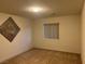 Neutral bedroom with carpeted floors, recessed lighting, and a small window at , Las Vegas, NV 89148