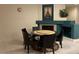 Cozy dining room features a fireplace, marble table, and decorative Eiffel Tower art at , Las Vegas, NV 89148
