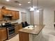 Kitchen with wood cabinets, stainless steel appliances, and center island with sink at , Las Vegas, NV 89148