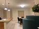 Kitchen with island, stainless steel sink, wood cabinets, and adjacent dining area at , Las Vegas, NV 89148