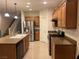 Open concept kitchen features stainless steel appliances and light tile flooring at , Las Vegas, NV 89148