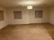 Spacious carpeted living room with ample natural light from three windows at , Las Vegas, NV 89148