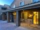 Covered patio features comfortable seating and an outdoor storage shed, with stairs visible through sliding glass door at , Las Vegas, NV 89148