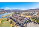 Gorgeous community view showcasing lush landscaping, waterfront homes, and scenic mountains at 1 Corte Belleza, Henderson, NV 89011