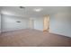 Bonus room with neutral carpet and access to other rooms, offering flexible living space at 10306 Coastline Creek Ct, Las Vegas, NV 89141